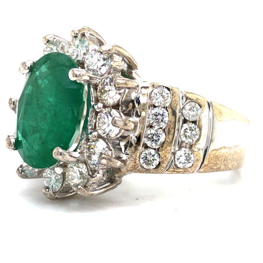 Oval-Cut Emerald and Stately Diamond Halo Ring