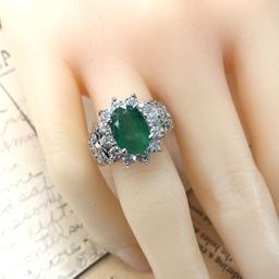 Oval-Cut Emerald and Stately Diamond Halo Ring