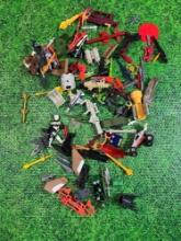 lot of vintage 80s 90s toy attachments and weapons