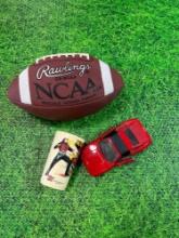 vintage metal Ferrari car, ncaa football, and 1985 mask venom cup