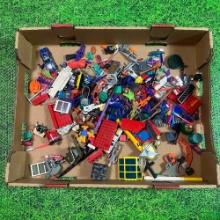 large flat of vintage 1980s toy accessories and parts