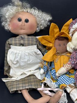 4 Various Cloth Dolls