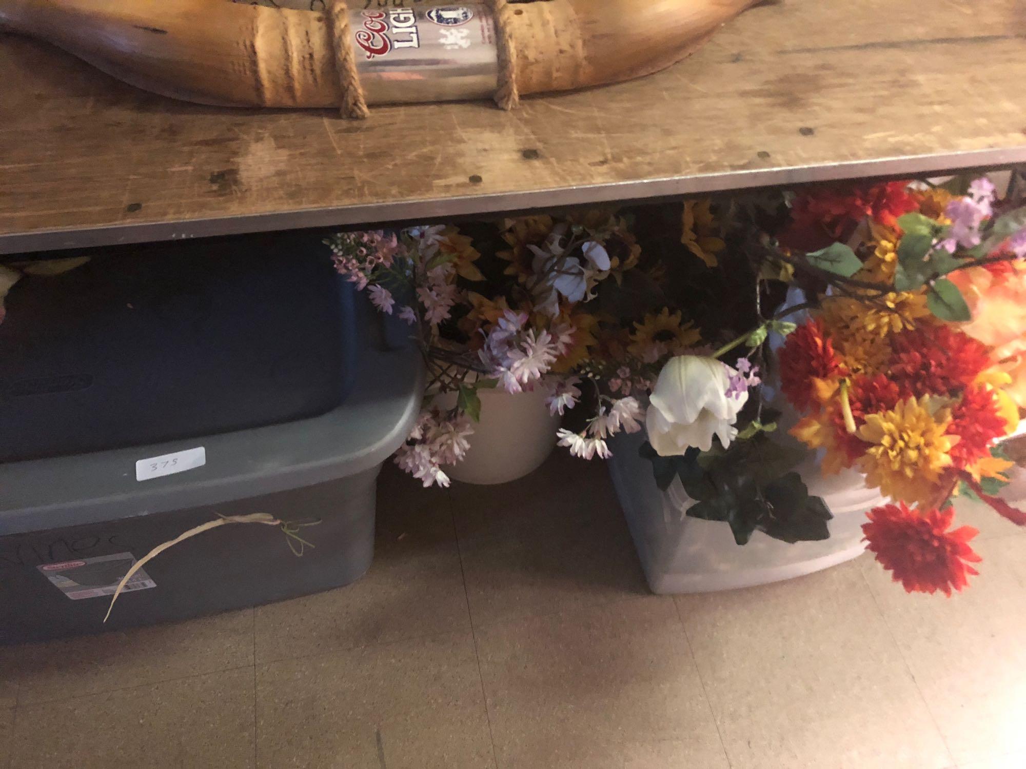 Assortment of faux flowers and decorations