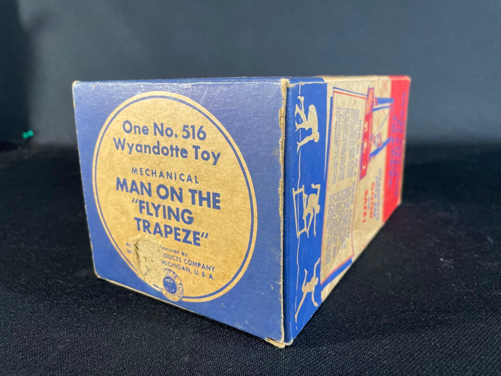 Wyandotte No. 516 Mechanical Man On The "Flying Trapeze" Tin Litho Wind Up Toy w/ Original Box