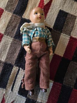 Porcelain cowboy doll