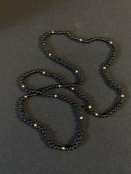 Small Black Onyx and gold colored beaded Necklace