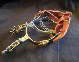 Western spurs with leather straps, brass horsehead decoration