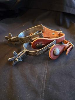 Western spurs with leather straps, brass horsehead decoration