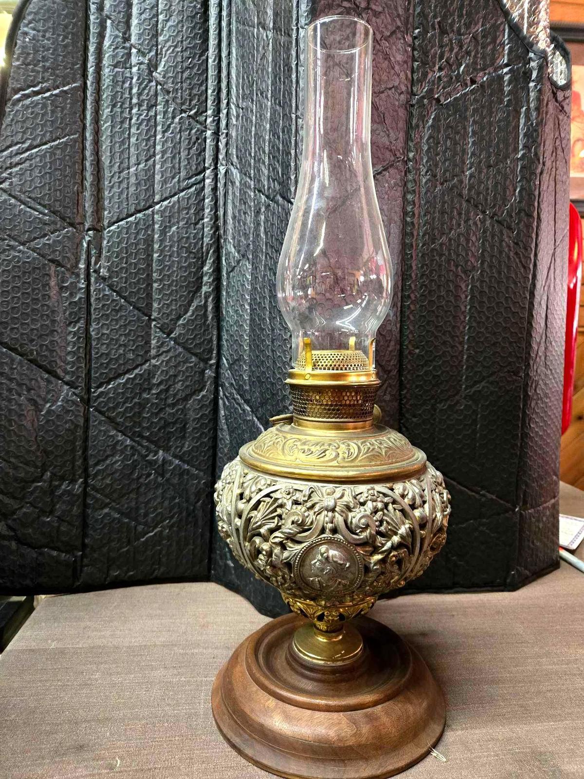 Ornate antique metal base oil lamp