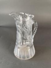 Brillant period cut Glass pitcher with an engraved Native man
