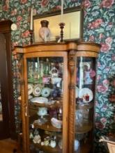 Oak curved glass china with lions heads and claw feet 1900