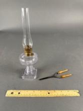 Child's kerosene lamp turning purple (pre 1917) w/ child's curling iron