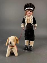 Bisque boy doll with his dog, doll marked 154 dep