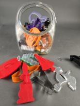 Large jar full of vintage cookie cutters