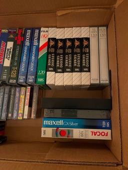 Assorted VHS And Cassette Tapes.
