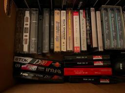 Assorted VHS And Cassette Tapes.