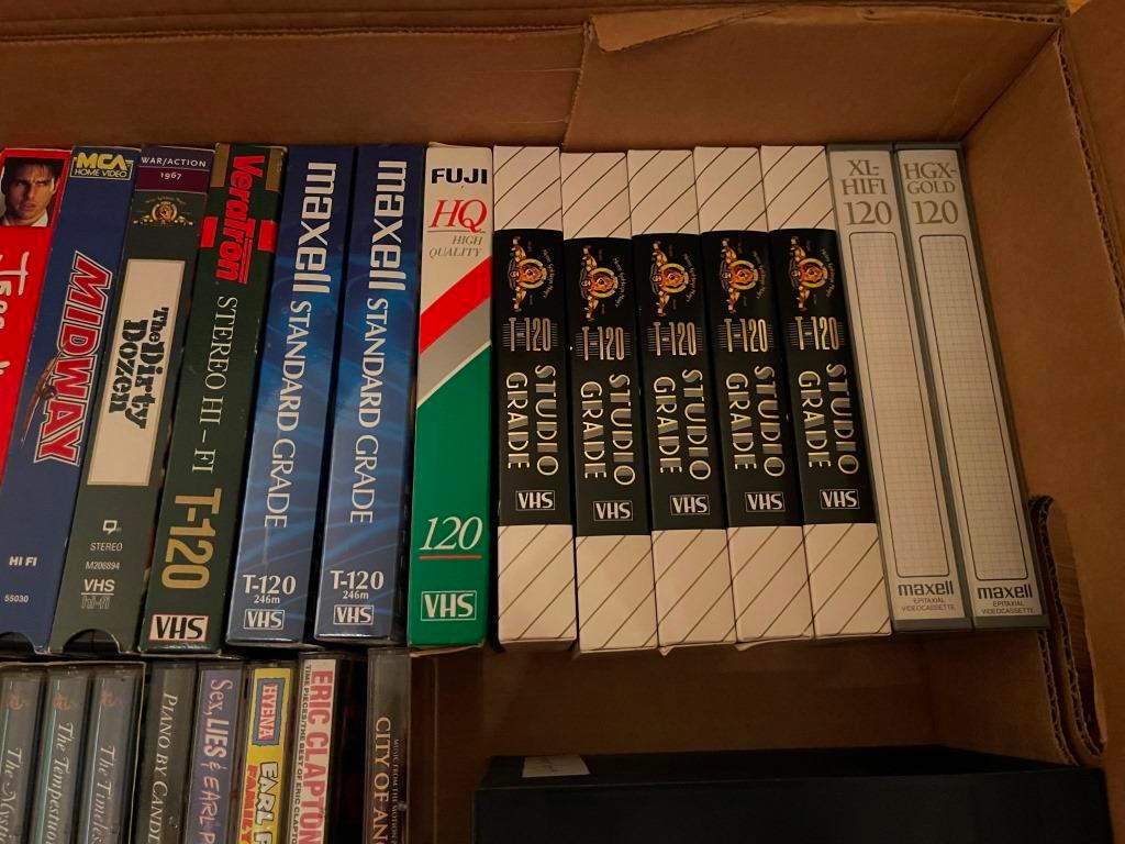 Assorted VHS And Cassette Tapes.