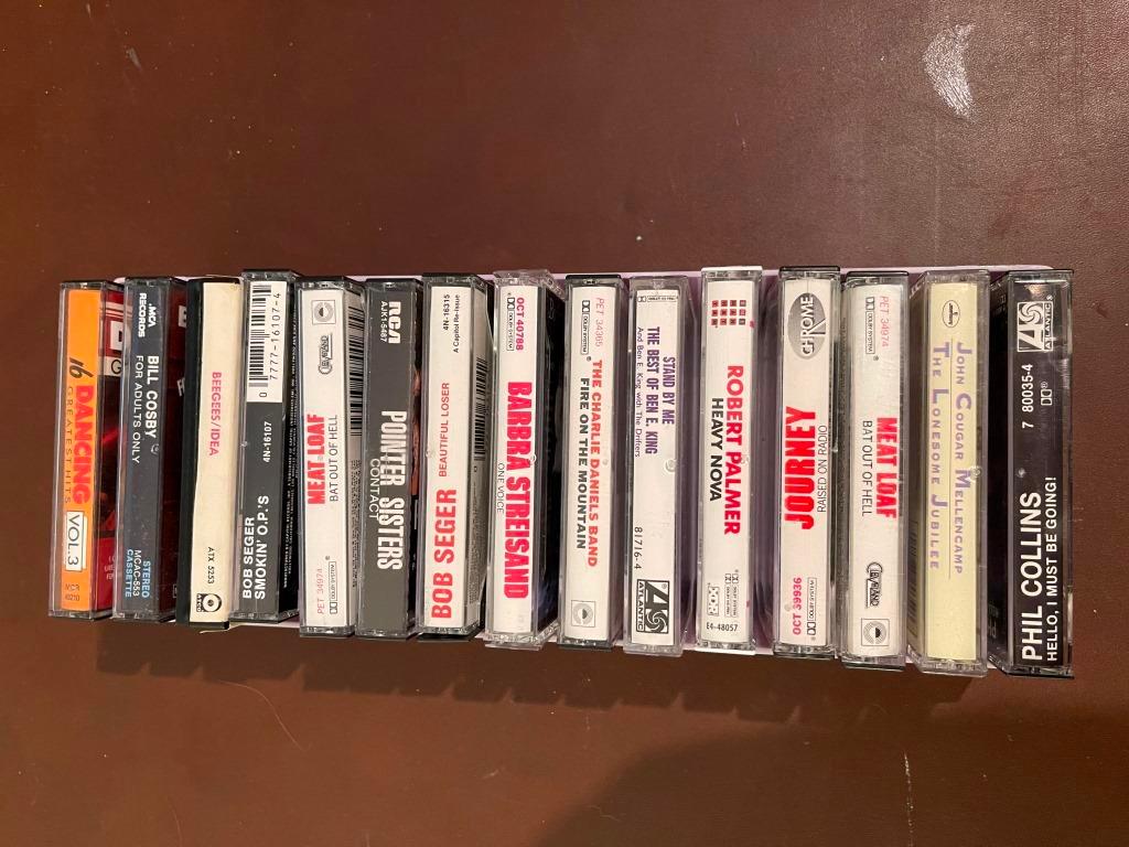 Assorted VHS And Cassette Tapes.