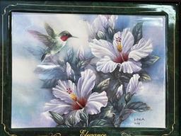 Hummingbird plates in a frame