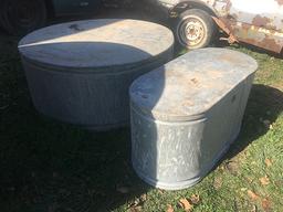 2 galvenized water tanks, appear to hold water