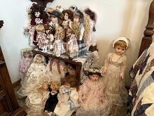 Collection of 24 Dolls, Small Stand, Corner Shelf, Pictures, Etc.