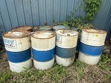 Lot of 6 55 gal Steel Barrels & (2) Plastic