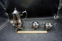 Silver service pieces.