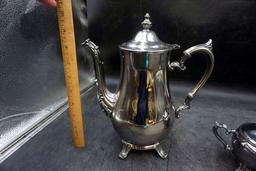 Silver service pieces.