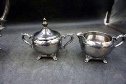 Silver service pieces.