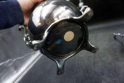 Silver service pieces.
