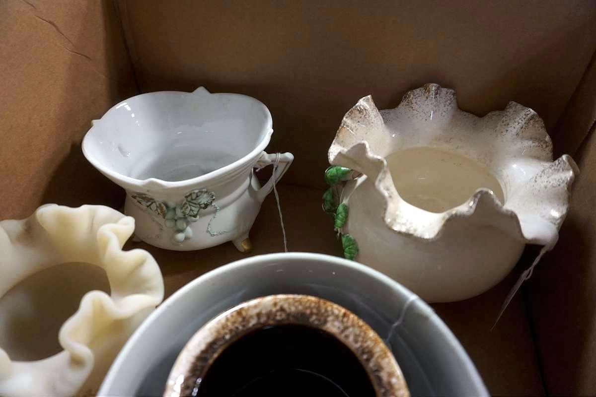 Box full of glassware, candleholders, and more.