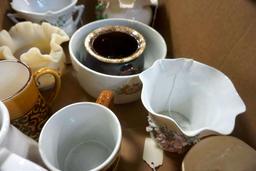Box full of glassware, candleholders, and more.