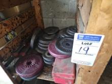 Assorted lifting weights with bar