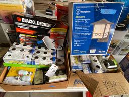 2 boxes of lights,calk gun & exterior light