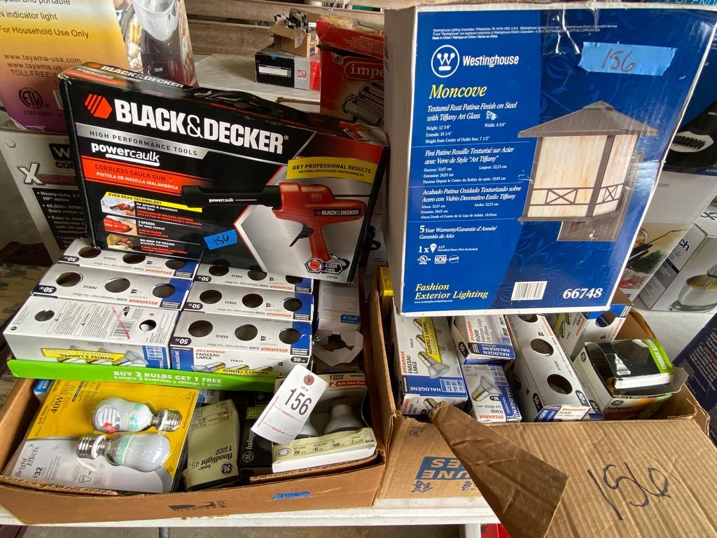 2 boxes of lights,calk gun & exterior light