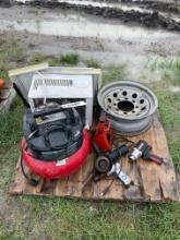 Pallet with air compressor,2 power tools,trailer rim & ac unit