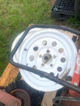 Pallet of 2 Rims, 1 Shredder Wheel, 2 Plow Discs, and Dollie
