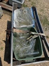 Crate Full of Glass Tubes Used At A Dairy Farm