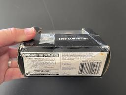 Hot Wheels on Card, Box is Crumpled but UNOPENED 98 Corvette Limited Edition With Display Case 1998