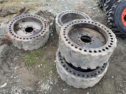 SET OF 4 solid skid steer tires and rims