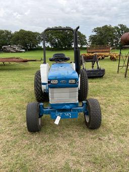 FORD 1520 WITH LOADER... DIESEL 2 WHEEL DRIVE... BUCKET WITH LOADER TURF TIRES ON THE TRACTOR REAR