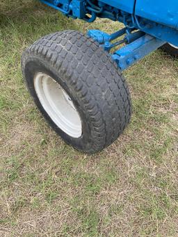 FORD 1520 WITH LOADER... DIESEL 2 WHEEL DRIVE... BUCKET WITH LOADER TURF TIRES ON THE TRACTOR REAR