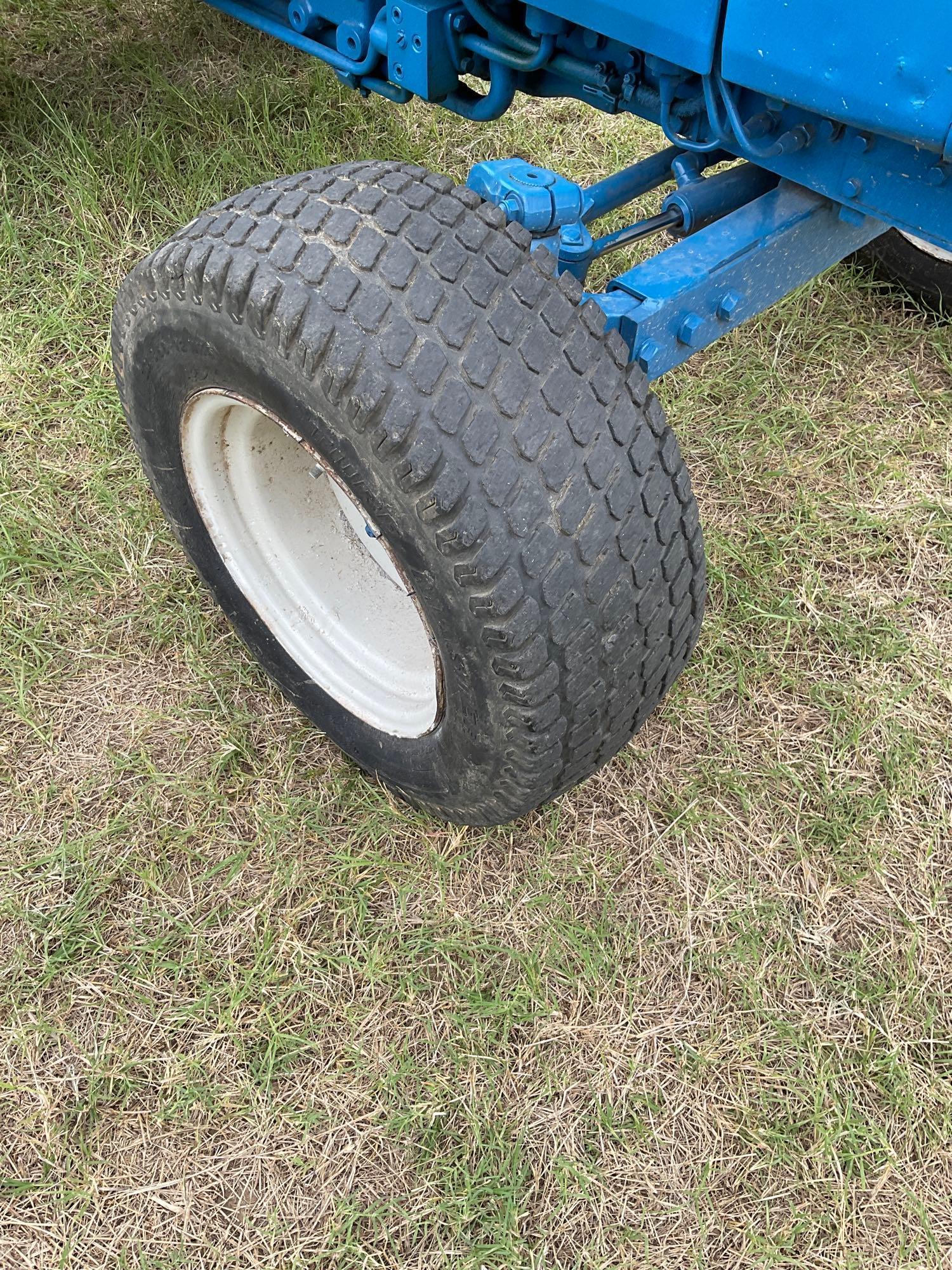 FORD 1520 WITH LOADER... DIESEL 2 WHEEL DRIVE... BUCKET WITH LOADER TURF TIRES ON THE TRACTOR REAR