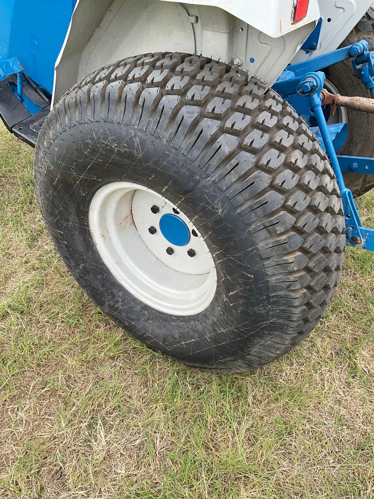 FORD 1520 WITH LOADER... DIESEL 2 WHEEL DRIVE... BUCKET WITH LOADER TURF TIRES ON THE TRACTOR REAR