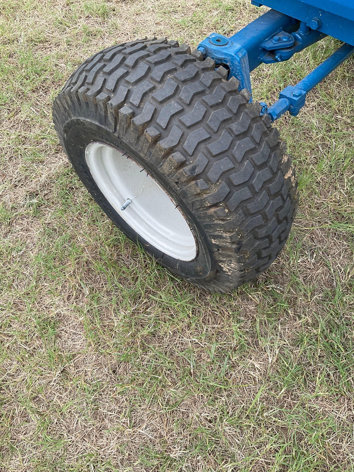 FORD 1520 WITH LOADER... DIESEL 2 WHEEL DRIVE... BUCKET WITH LOADER TURF TIRES ON THE TRACTOR REAR