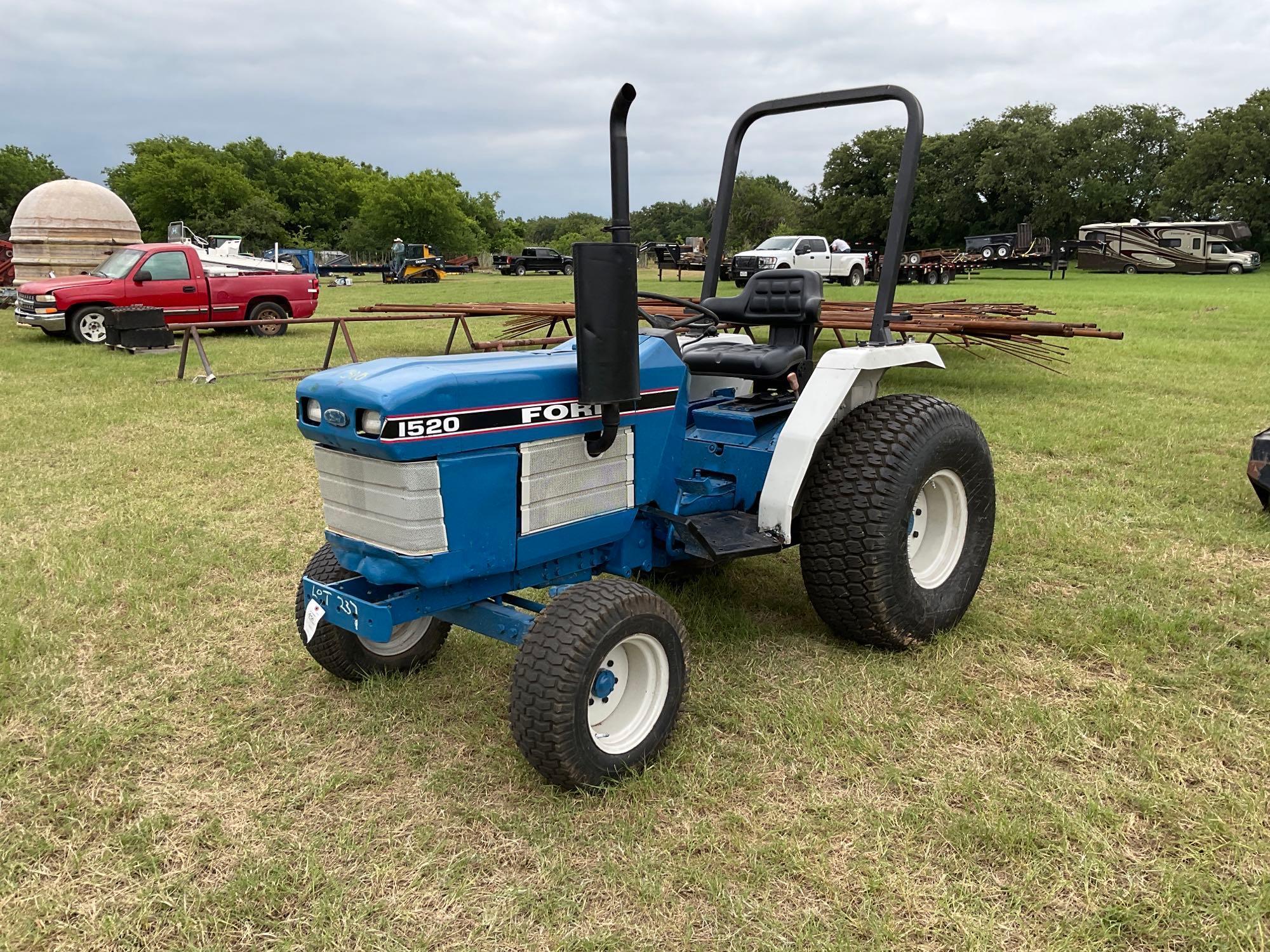FORD 1520 WITH LOADER... DIESEL 2 WHEEL DRIVE... BUCKET WITH LOADER TURF TIRES ON THE TRACTOR REAR
