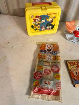 Ceramic clown head, lunchbox, fisher price car....