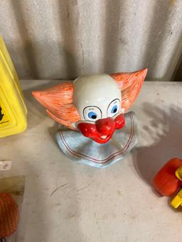 Ceramic clown head, lunchbox, fisher price car....