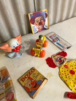 Ceramic clown head, lunchbox, fisher price car....
