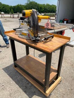 DEWALT MITER SAW ON TABLE 12" BLADES, CASTERS ON TABLE GOOD WORKING CONDITION...